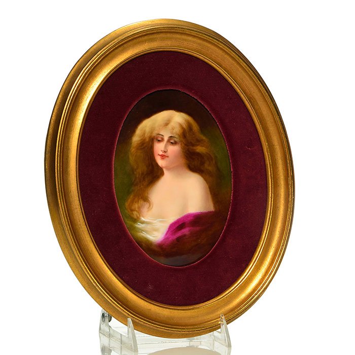 Hutschenreuther porcelain plaque, Maiden, 5 3/4": Hutschenreuther porcelain plaque, the portraiture of a demure maiden with auburn tresses, modestly attired in a veiled bodice and a maroon cloak. Plaque measurement is 5 3/4 inch by 7 5/8 inches. The 