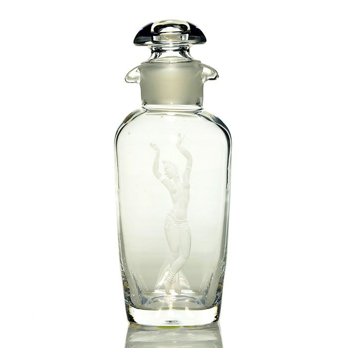 Orrefors stoppered decanter, intaglio dancer, 9 1/2": Orrefors spirit decanter with mushroom stopper by Vicke Lindstrand. The double spouted container is intaglio carved with an exotic nude dancer. Height 9 1/2 inches. Engraved "Orrefors, Lindstrand, 682