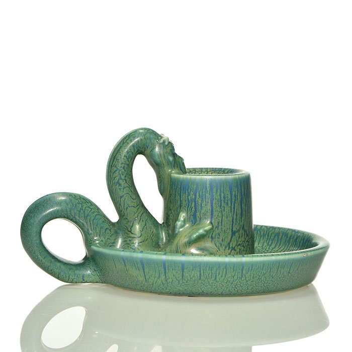 Rookwood dragon handle candle holder, 1930, 3 3/8": Candle holder with a dragon clutching the candle cup as a handle, cast in 1930 and covered with green and blue mat glazes for a nice frog-skin effect. Marks include the Rookwood logo, date and shape 2