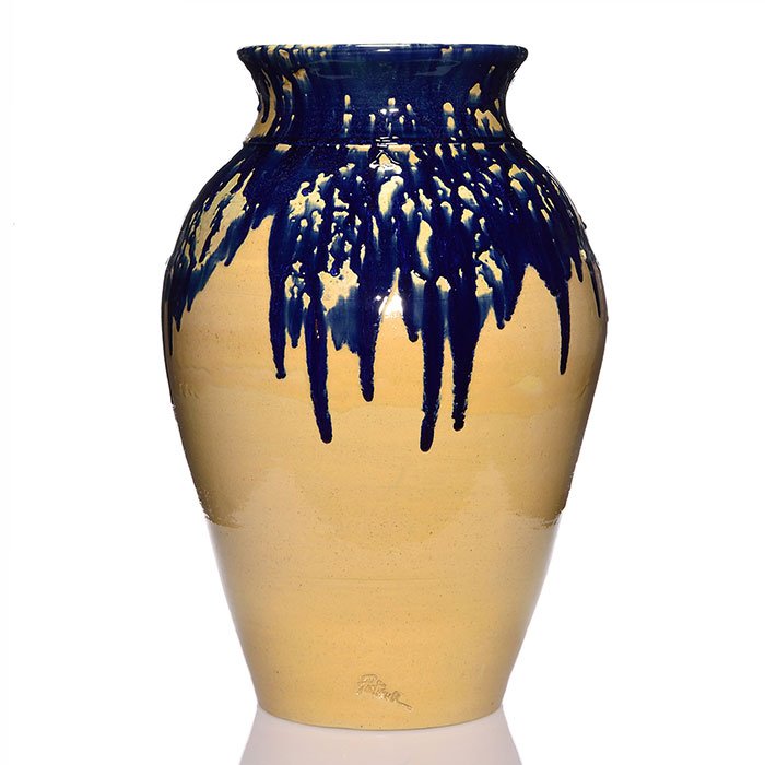 Zanesville Stoneware Pickrull vase, blue, tan, 27": Massive Zanesville Stoneware hand-thrown 27 inch floor vase covered in tan high glaze and having cobalt blue dripped from the rim, the work of Lawrence Pickrull who signed the piece on the side. Impre