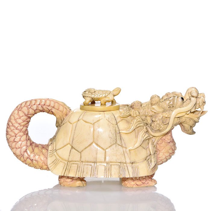 Carved bone Turtle Dragon scent box, 6 1/2": Unusual Dragon turtle scent box, circa possibly 1880's, of an intricate bone carved figure with cover of a mother turtle and baby. Measures 3 inches by 6 1/2 inches long. Graphite and coral polychrome