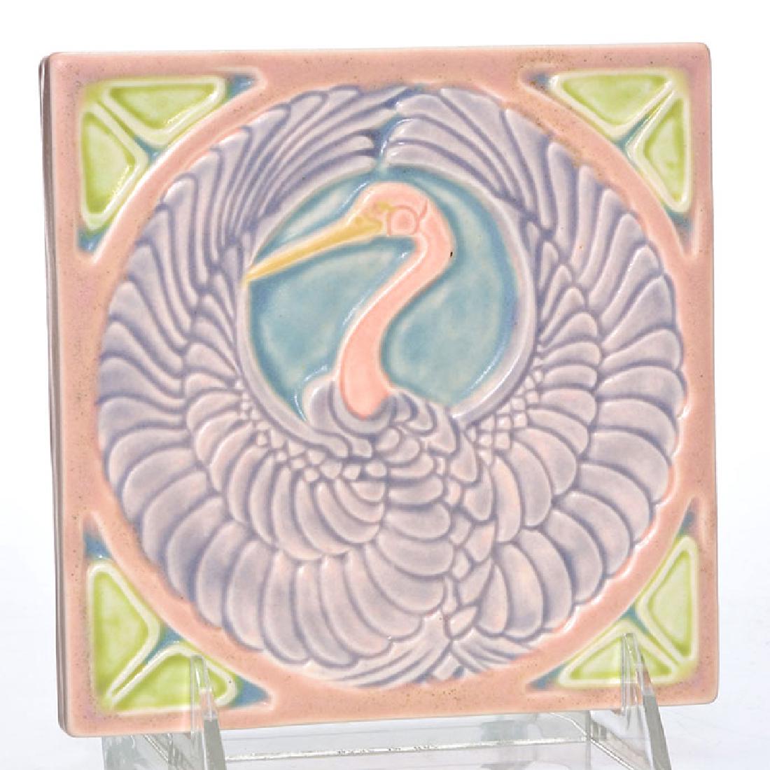 Rookwood Crane trivet, 1922, 2047, 5 1/2 inches: Rookwood Crane trivet done in rich pastel colors in 1922. Marks include the company logo, the date and shape number 2047. Size is 5 1/2 inches square. Uncrazed but with some tiny peppering.