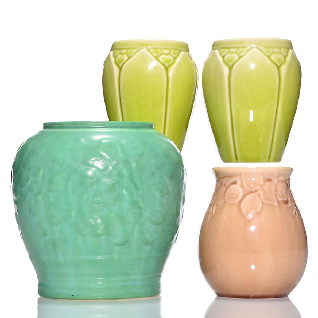 4 pieces of Rookwood, 1945, 1946,6886,2122,2090, 5 3/4": Four Rookwood vases, all with molded floral design. 1) shape 6886, cast in 1945 and covered with a green mat glaze. There is a wheel ground line indicating the piece as a 2nd due to heavy glaze. Heigh