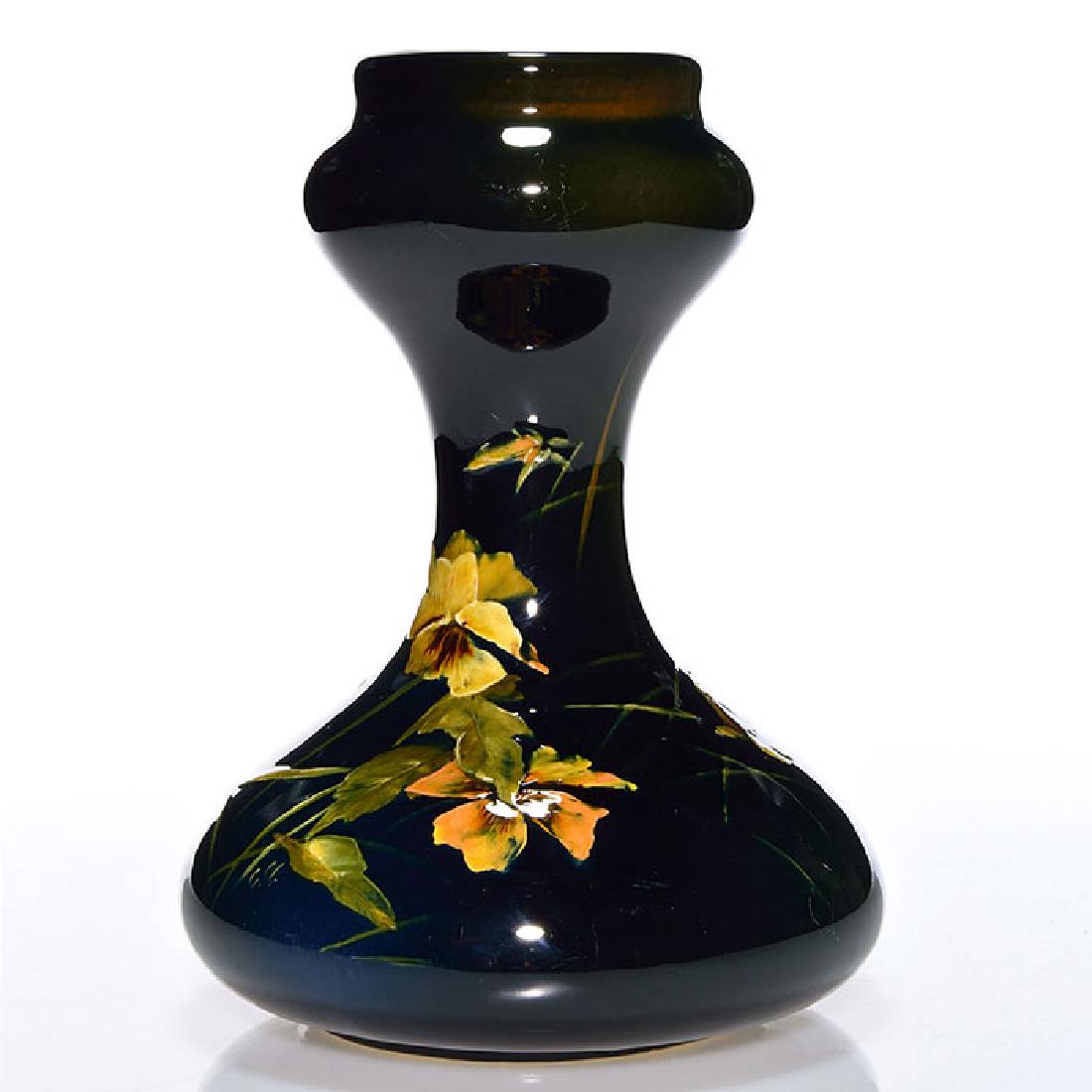 Weller Dickens Ware I lamp vase, 10 1/2 inches, pansies: Weller First Line Dickens Ware lamp vase with pansy decoration done by an artist who added their initials, C.M, in yellow slip. Impressed on the bottom Weller Dickens Ware and 355. There is fine overa