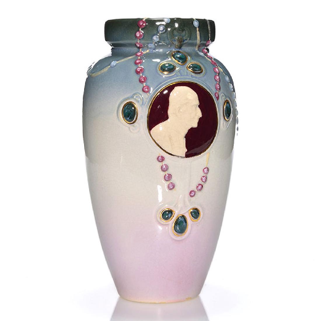 Weller Cameo Jewel vase, Pope Pius X, 10 inches: Weller Cameo Jewel vase with the embossed profile of Pope Pius X along with many jewels in the form of a rosary. Marked WELLER in block letters. There is fine overall crazing. Height is 10 inches.