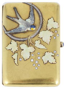 A DIAMOND GOLD AND ENAMEL CIGARETTE CASE 1890s oblong: A DIAMOND GOLD AND ENAMEL CIGARETTE CASE 1890s oblong the front applied with an enamelled swallow flying through a rose diamond set hoop hung with creamy enamelled vine leaves and fruit of circular di