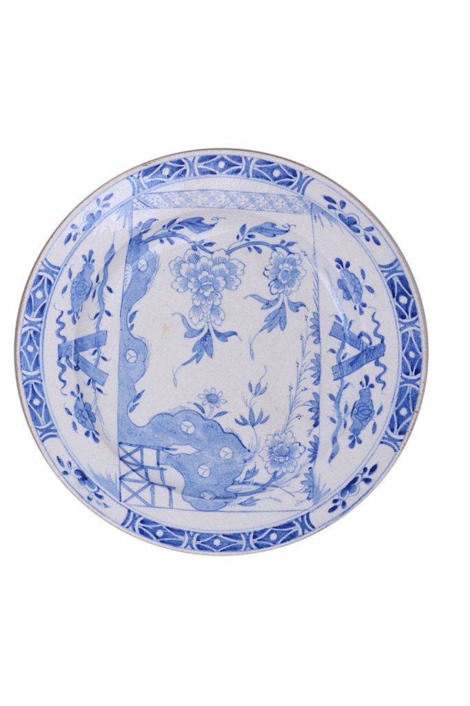 A BOW PLATE, CIRCA 1755 painted in underglaze blue with