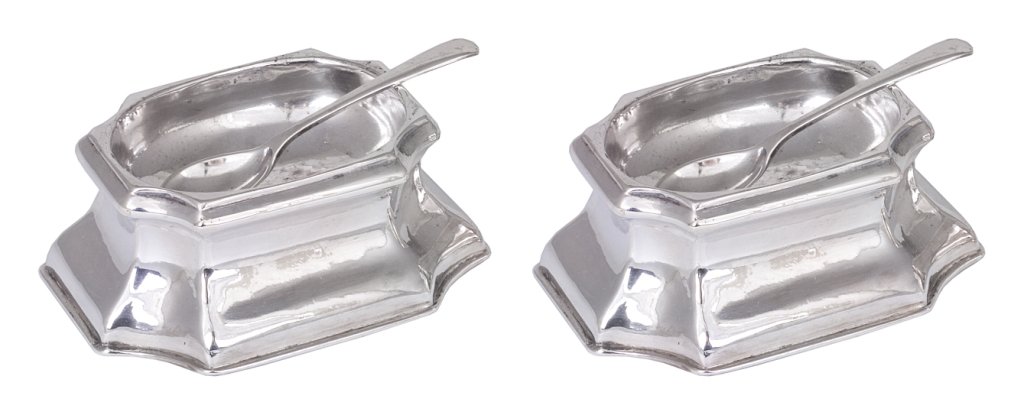 A PAIR OF GEORGE II SILVER TRENCHER SALTS, JAMES SMITH,: A PAIR OF GEORGE II SILVER TRENCHER SALTS, JAMES SMITH, LONDON, 1735 waisted rectangular with in-curved corners, undersides initialled MC EB; together with two silver salt spoons, Birmingham & Sheffie