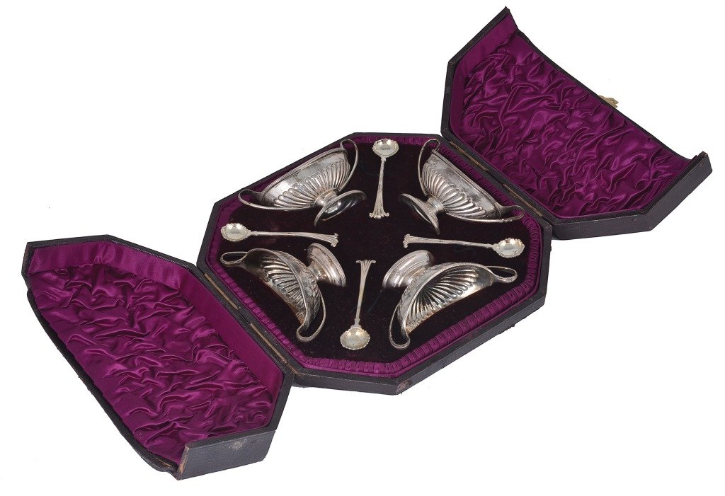 A CASED SET OF FOUR VICTORIAN SILVER SALT CELLARS AND: A CASED SET OF FOUR VICTORIAN SILVER SALT CELLARS AND SPOONS, CHARLES STUART HARRIS, LONDON, 1890 pedestal navette shaped, part lobed, reeded rims, gilt interiors, Onslow pattern spoons with scalloped