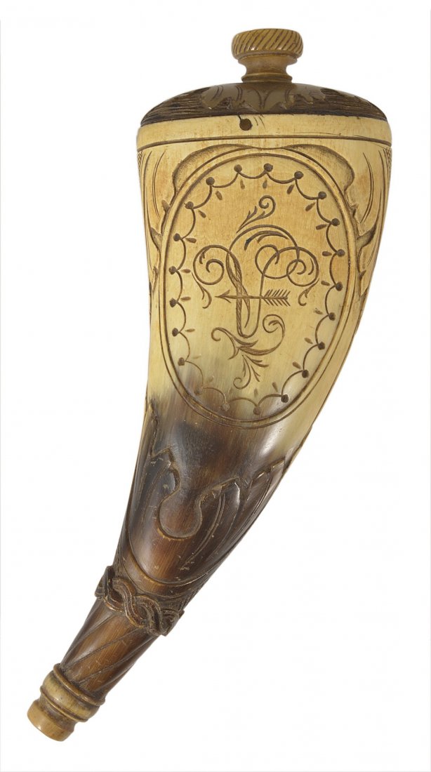 A HORN GLOVE POWDERER, PROBABLY GERMAN, DATED 1908 in: A HORN GLOVE POWDERER, PROBABLY GERMAN, DATED 1908 in 18th century taste, carved with acanthus and an initialled and a dated oval 16cm long