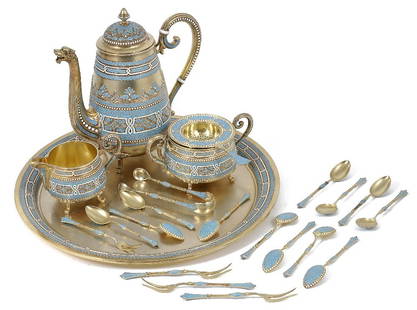 A NORWEGIAN SILVER-GILT AND CLOISONNE ENAMEL COFFEE: A NORWEGIAN SILVER-GILT AND CLOISONNE ENAMEL COFFEE SERVICE, MARIUS HAMMER, BERGEN, CIRCA 1900 comprising: a coffee pot, a cream jug, a sugar basin, a strainer, a circular tray, a pair of sugar tongs,