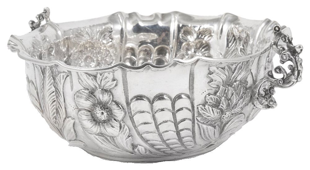 A VICTORIAN SILVER SWEETMEAT DISH, CHARLES STUART: A VICTORIAN SILVER SWEETMEAT DISH, CHARLES STUART HARRIS, LONDON, 1889 shaped oval, in 17th century German style, chased with panels of flowers and scalework, applied to the sides with cast openwork s
