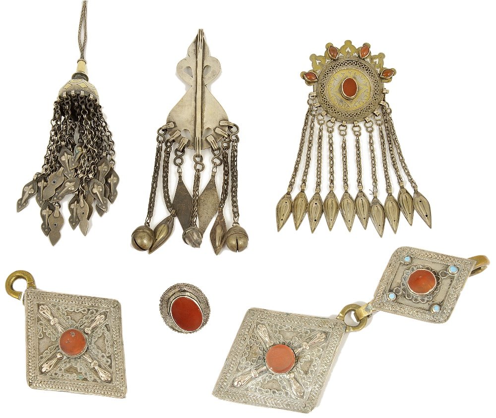 SIX ITEMS OF TURKMEN JEWELLERY, CENTRAL ASIA, 19TH: SIX ITEMS OF TURKMEN JEWELLERY, CENTRAL ASIA, 19TH CENTURY silver and silver gilt, inlaid with carnelians and turquoises, comprising a lozenge-shaped pendant, a double lozenge-shaped pendant, a disc, 