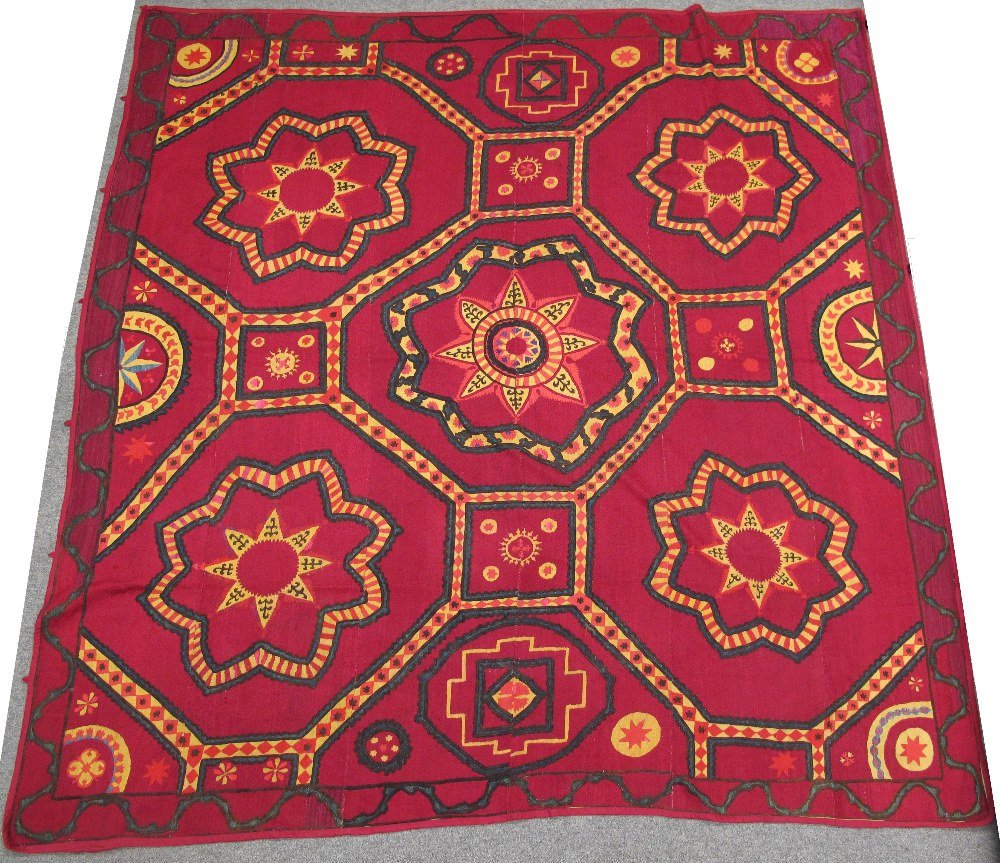 A PSKENT SUSANI, UZBEKISTAN, CIRCA 1900 cotton: A PSKENT SUSANI, UZBEKISTAN, CIRCA 1900 cotton embroidered with silk and cotton, the design comprising a repeated trellis of octagons, each containing a star motif 241 x 255cm approx.