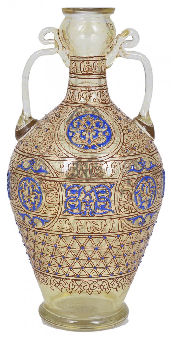A FRENCH ENAMELLED GLASS MAMLUK STYLE FLASK,: A FRENCH ENAMELLED GLASS MAMLUK STYLE FLASK, PHILIPPE-JOSEPH BROCARD, PARIS, LATE 19TH CENTURY bottle shaped, the amber tinted glass covered in red line borders, gilt scrollwork and stylised Arabic in