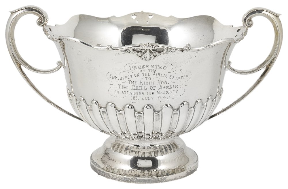 AN EDWARDIAN SILVER ROSE BOWL, MARTIN, HALL & CO. LTD,: AN EDWARDIAN SILVER ROSE BOWL, MARTIN, HALL & CO. LTD, SHEFFIELD, 1908 chased with a band of alternate lobes and flutes below a presentation inscription, applied to the rim with scrolls interrupted by