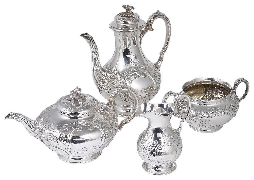 ˜A VICTORIAN SILVER FOUR-PIECE TEA AND COFFEE SET,: ˜A VICTORIAN SILVER FOUR-PIECE TEA AND COFFEE SET, EDWARD BARNARD & SONS, LONDON, 1898/99 the bulbous bodies chased with foliage and scrolls around vacant cartouches, on rim feet, pots with cast flow