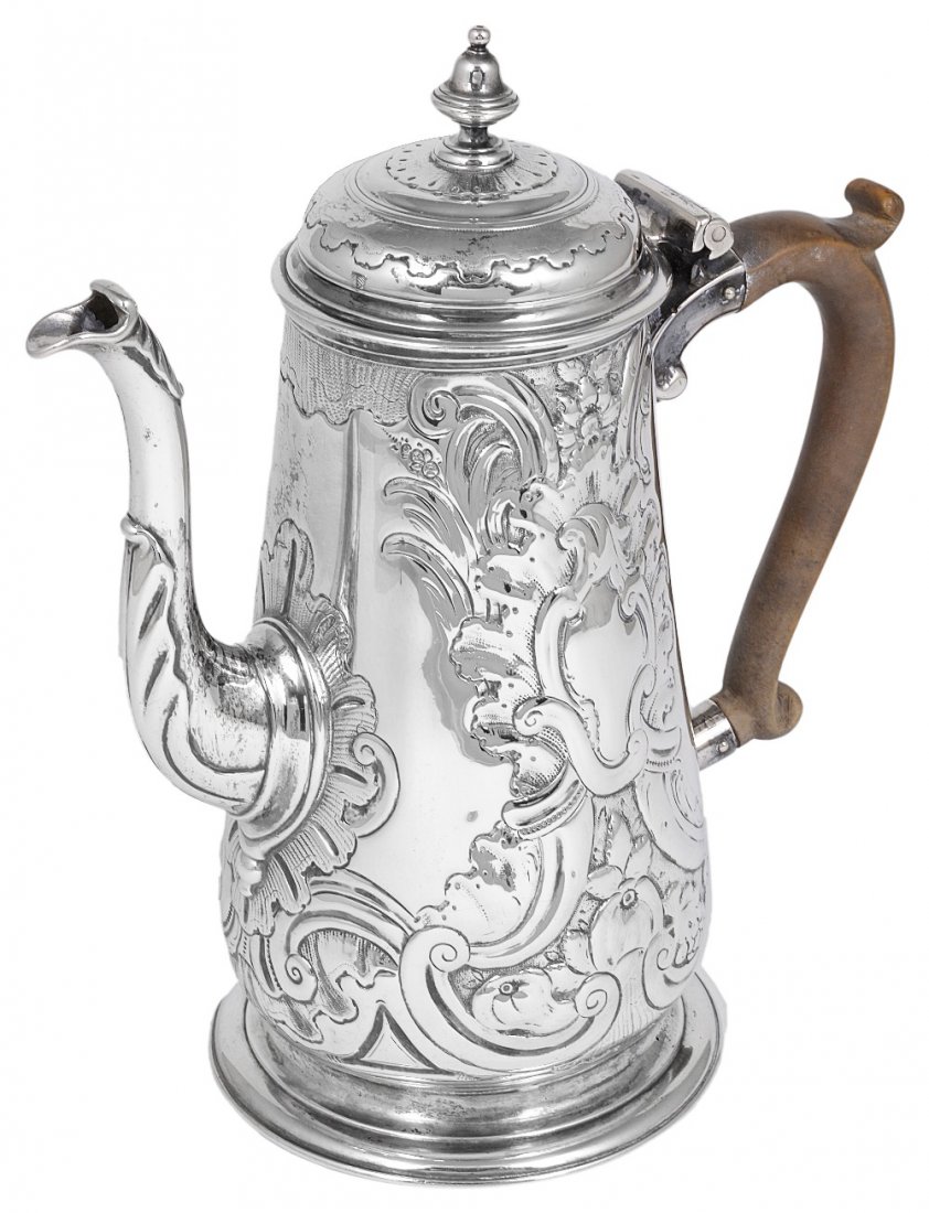 A GEORGE II SILVER COFFEE POT, THOMAS MASON, LONDON,: A GEORGE II SILVER COFFEE POT, THOMAS MASON, LONDON, 1741 tapering cylindrical, chased (probably at a somewhat later date) with exuberant rococo cartouches, fruit and scrolls, silver vase-shaped finia
