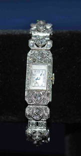 Ladies' Platinum Diamond Watch: Ladies' Platinum Diamond Dinner Watch Marvin watch, 15 jewels; approximately 4 carats total, 3 ½ inches long with 1 inch of cord on either end 13.00 dwts. inclusive