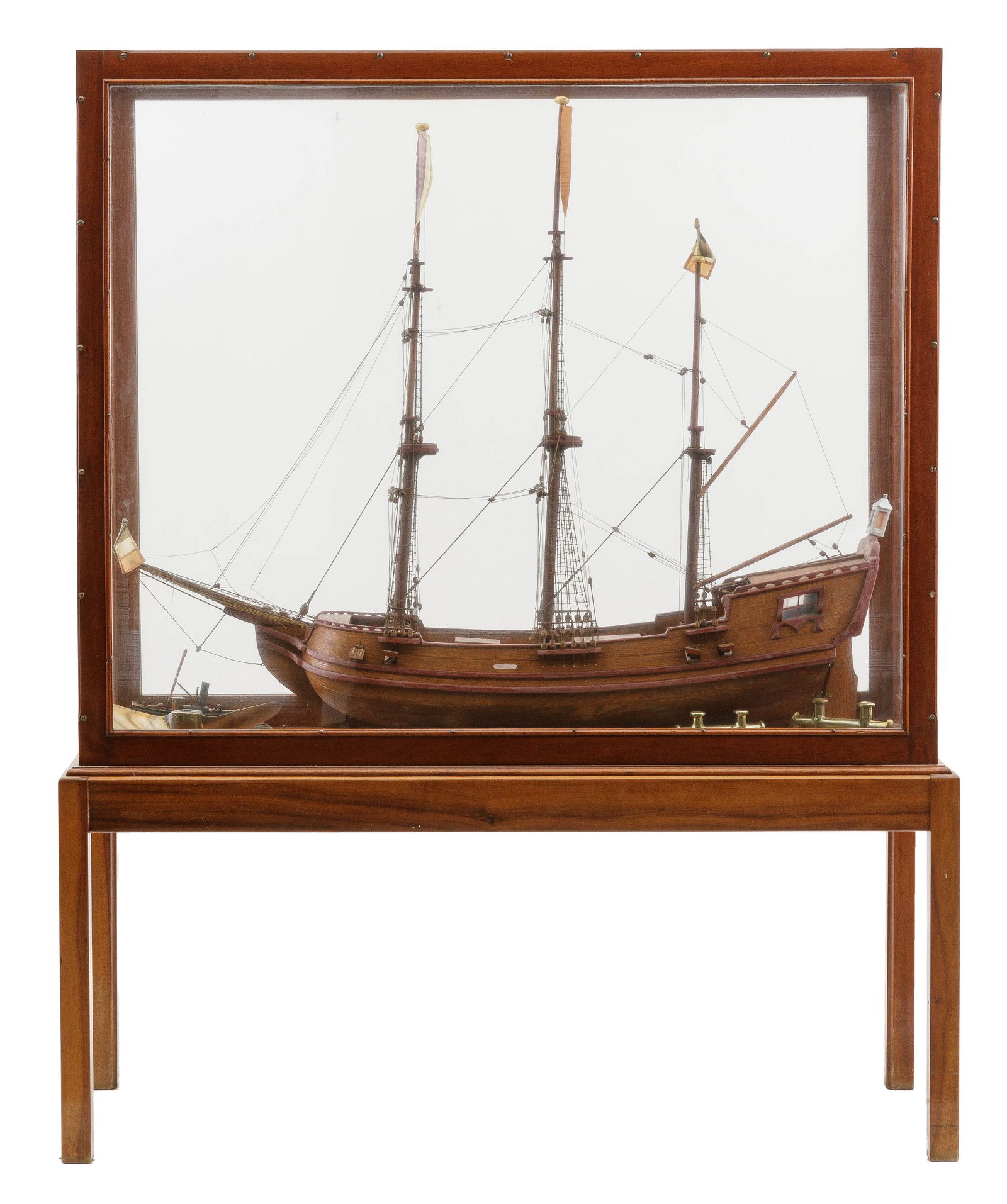 Model of a three pine masted state yacht with four canons on each port and starboard side, fully rig: Description ENModel of a three pine masted state yacht with four canons on each port and starboard side, fully rigged without sails, aft cabin with four windows in a mahogany display case. With brass