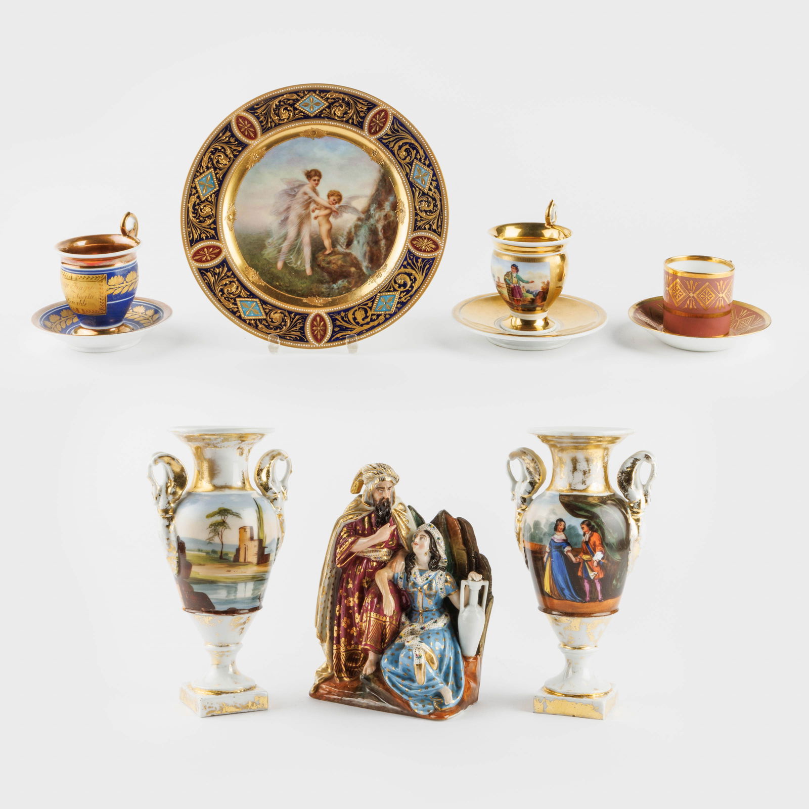 Seven pieces of 19th-century partially gilded porcelain.
Consisting of a pair of vases, three cups a (1 of 8)