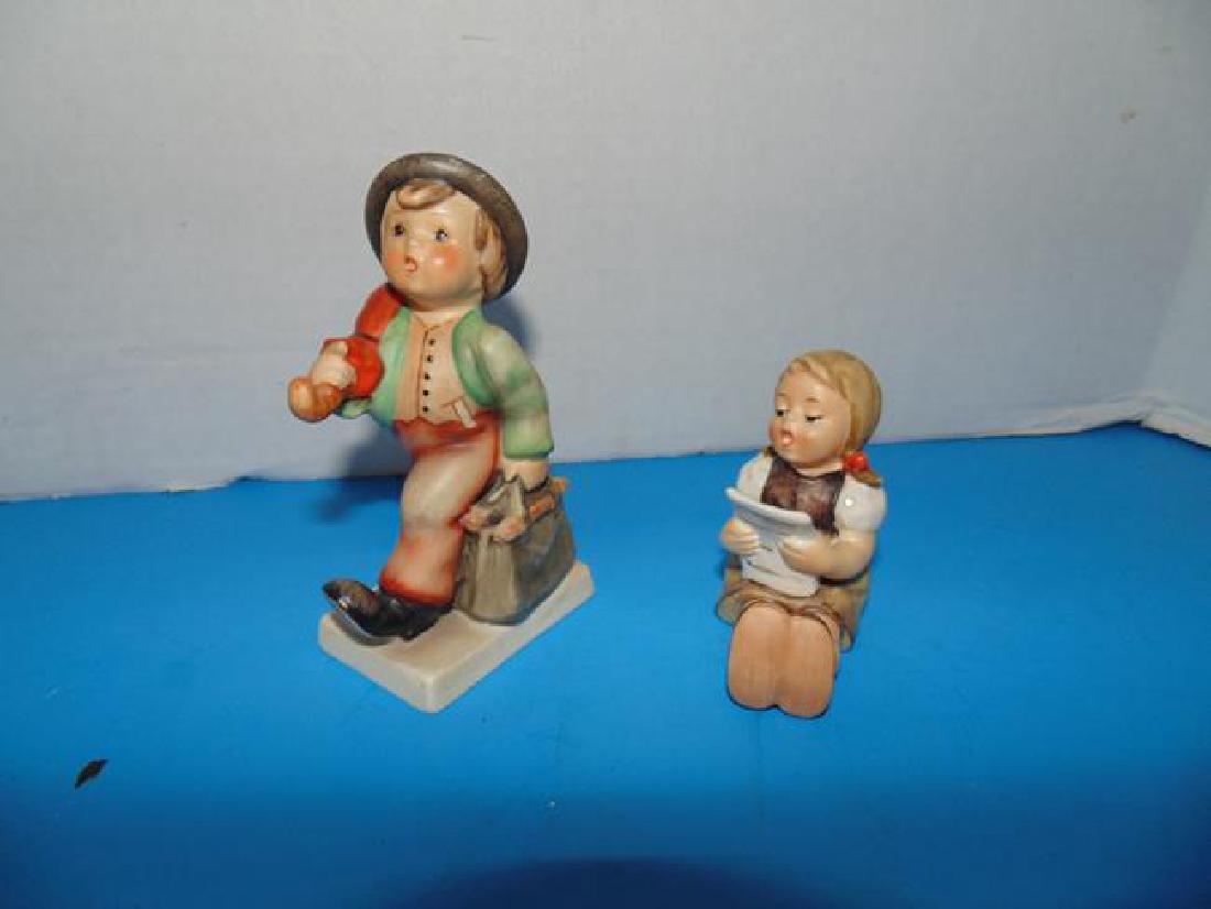 2 Hummels: Happy Traveller and Girl with Sheet Music #389 Very good condition.