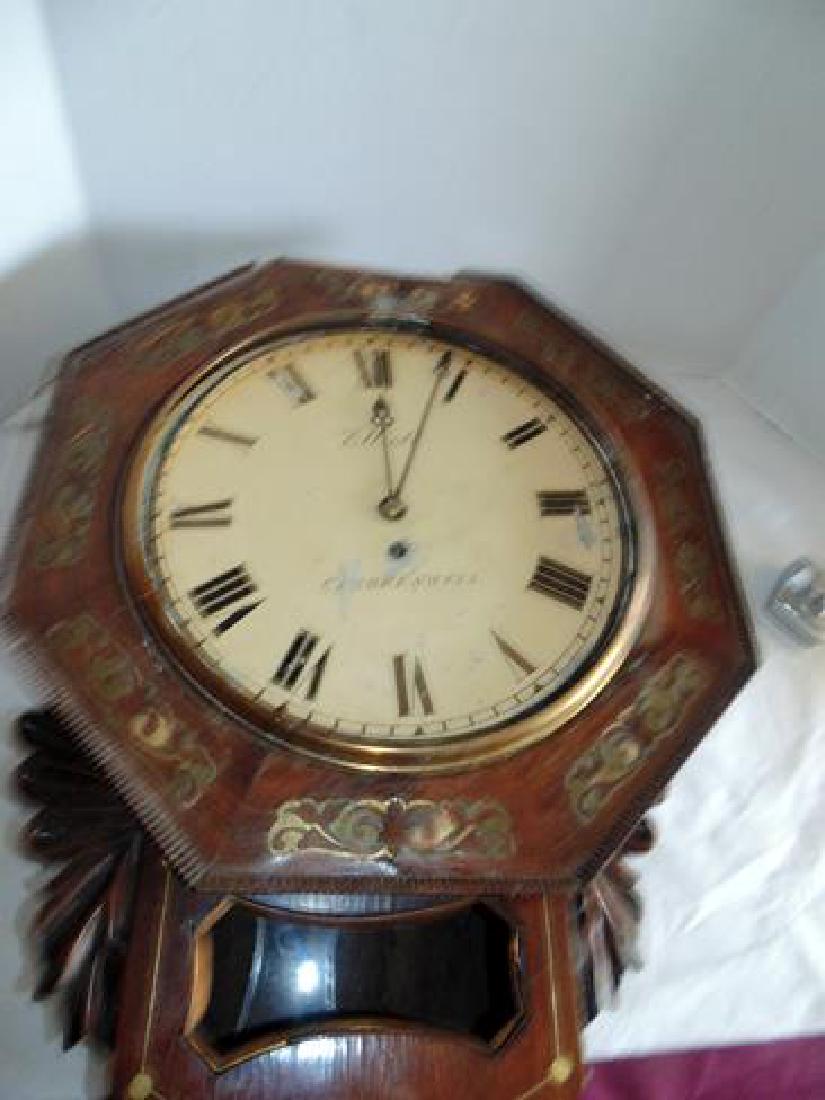Clock with Brass Inlay: Wall clock with brass inlay around face. Elliott Clerkenwell on face. Needs work. 64893