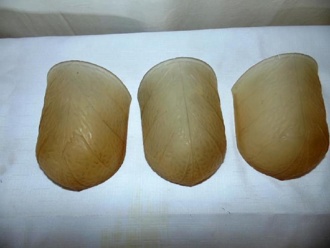 Art Deco Glass Light Shades: Set of 3 Art Deco frosted amber glass light shades 5 3/4" x 4". Chip on side of one shade.