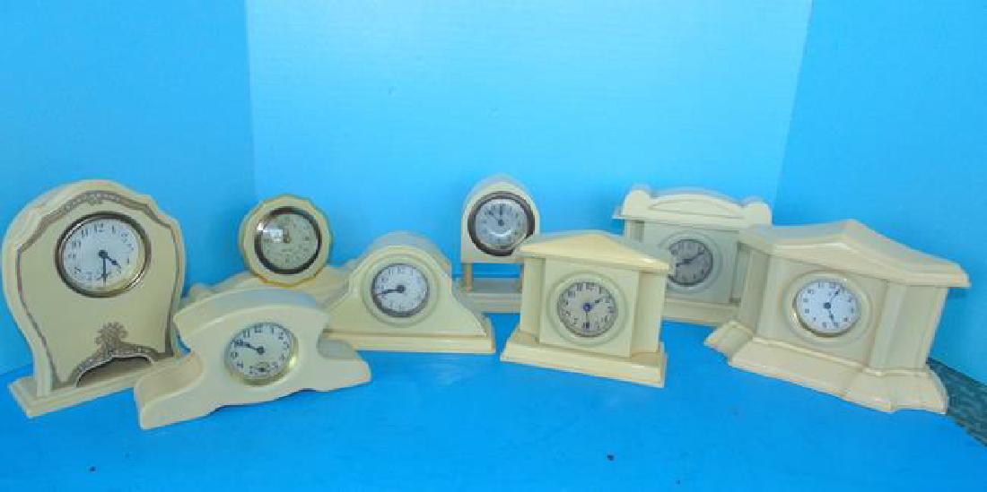 8 Celluloid Desk Clocks: Group of 8 celluloid desk clocks. The mechanical condition of clocks and watches is not guaranteed, nor is the disclosure of any replaced or missing parts. When the term "running" is used it only mean