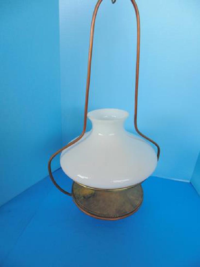 Hanging Oil Lamp: Hanging oil lamp with white glass shade.
