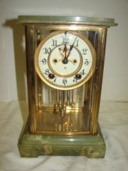 Green Alabaster Brass Clock with Beveled Glass Ope: Open Escapement Ansonia . Clock has Pendulum. No key.