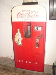 Coca Cola Coke 10 Cent Vending Machine: Round Top 10 cent machine in working order. Good condition.