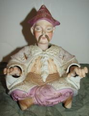 Bisque Nodding Figure of Asian Man Nodding: Nodding head and hands. Very good condition. 7" tall by 6" wide.