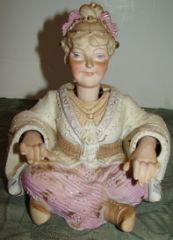 Bisque Nodding Figure of Asian Woman: Hands and Head Nod. Very good condition. 7" tall by 6" wide.