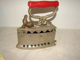 Cast Iron Coal Iron with Figural Latch: Iron measures 8" tall and 7 1/2" long. Latch to open is a gilted rooster. Very good condition.
