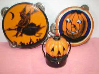 2 Tin Litho Halloween Tambourines & Light : Tambourine with Witch 7" and marked J. Chein USA. 6" Pumpkin tambouring and Pumpkin light with glass pumpkin and metal bottom. Very good condition.