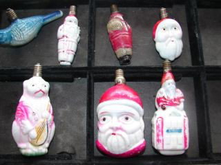 Group of Glass Christmas Figural Lights : Group of 7 Christmas lights including a Bear playing a Mandolin, Santa, Bird . /Good condition.