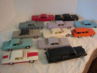 12 Plastic Model Cars Assorted : Assorted cars from the 60 including a hearse, Chevrolet and Buicks. Also included in this lot misc. cars and parts.
