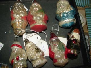 6 Santa Claus Glass Christmas Ornaments : This lot contains 7 Santa Claus Glass Ornaments. One Large Blue Santa Claus measuring 4"and One 3" Green Santa Claus. Plus red and silver santas. 7th santa is white with red trim and has damage. See p