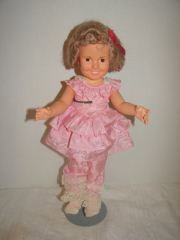 Ideal Shirley Temple 1972: 1972 Ideal Shirley Temple Marked on back of head 2M-5634. Stationary Eyes. Pink ruffled outfit. Good condition.