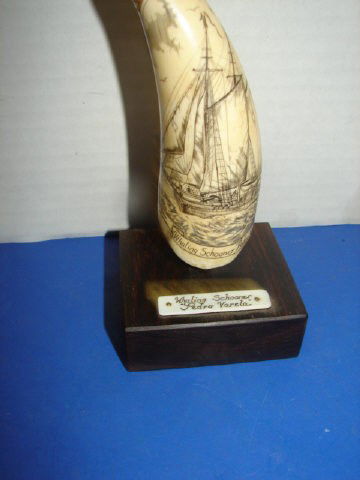 Carved Ivory Nantucket Schrimshaw: Signed Charles Maghis 6" long. Very good condition.