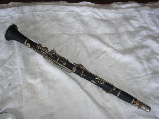 Wood Clarinet by GL Penzel: Clarinet made by GL Penzel measures 26 1/2" long. Good condition.
