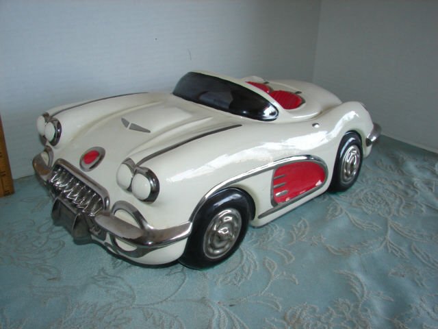Signed Glenn Appleman Sports Car: Signed and numbered Glenn Appleman cookie jar. measures 18" long. 2 Small chips One just below the windshield on the car body and other other on the trunk. (see photo). Very Good condition.