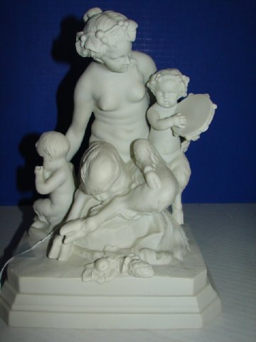 Parian Grouping of Mythological Goat Woman & Childr: Mythological parian figure of Half Goat woman and half goat children. Measures 10 1/2 x8". Signed on back of figure. Very good condition.