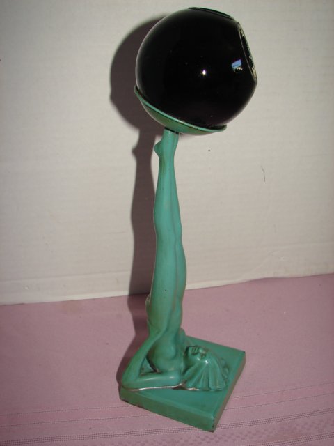 Frankart Nude Figural Ashtray: Signed Frankart Nude figural ashtray measuring 12" tall. Black glass ball shape ashtray. Very good conditon.