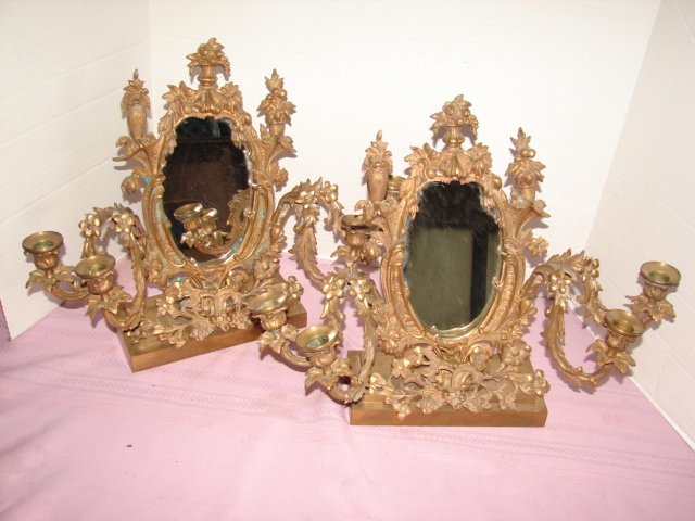 Pair of Bronze Mirrored Table Sconces: Ornate American bronze mirror sconces with removeable arms and base. Measure 14" x 17". Very good condition.