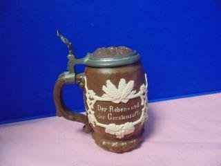Villeroy & Bach Mettlach Stein: Signed and numbered 1028 5 1/2" tall stein with pewter mounts. Face in center of lid. Very good conditoin.