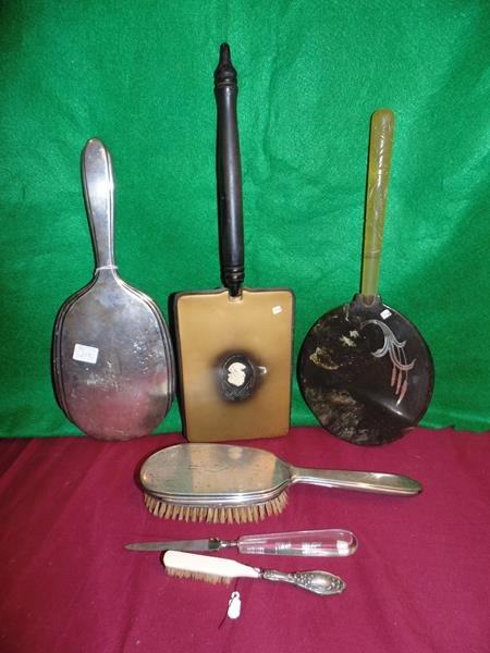 Hand Mirrors Including Sterling Silver Group of: Group of assorted hand mirrors including a sterling silver mirror, bakelite, wood, sterling brush and a lucite nail file. Very good condition.