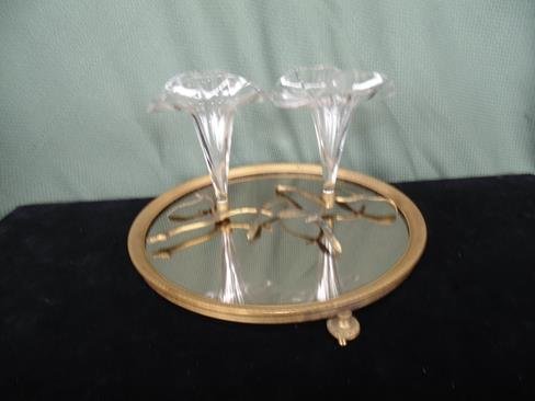 2 Brass Twig Bud Vases & Brass Center Plate: 10" round footed brass framed mirror plateau with 2 brass twig epengnes 5" tall. Very good condition.