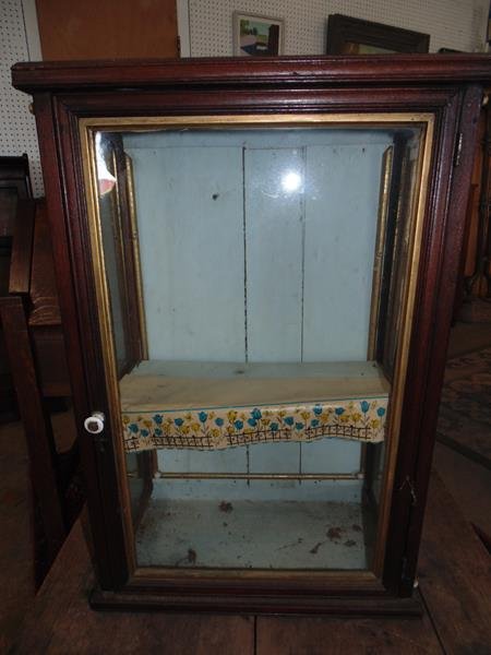 Walnut Wall Curio Cabinet: Walnut curio cabinet 23x16x8". Gilt framed sides with white glass button decoration. Very good condtion.